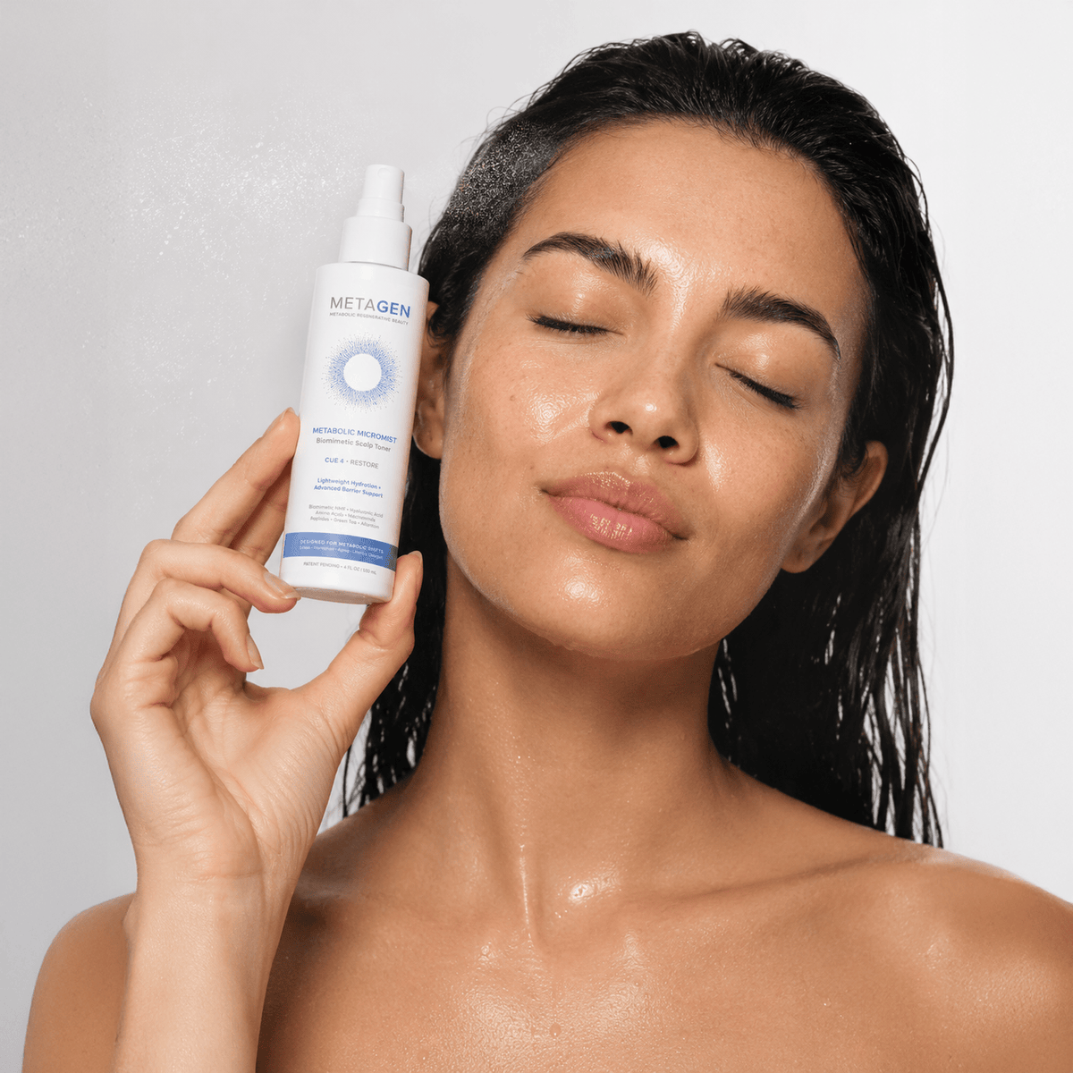 Woman with Metagen scalp-care mist